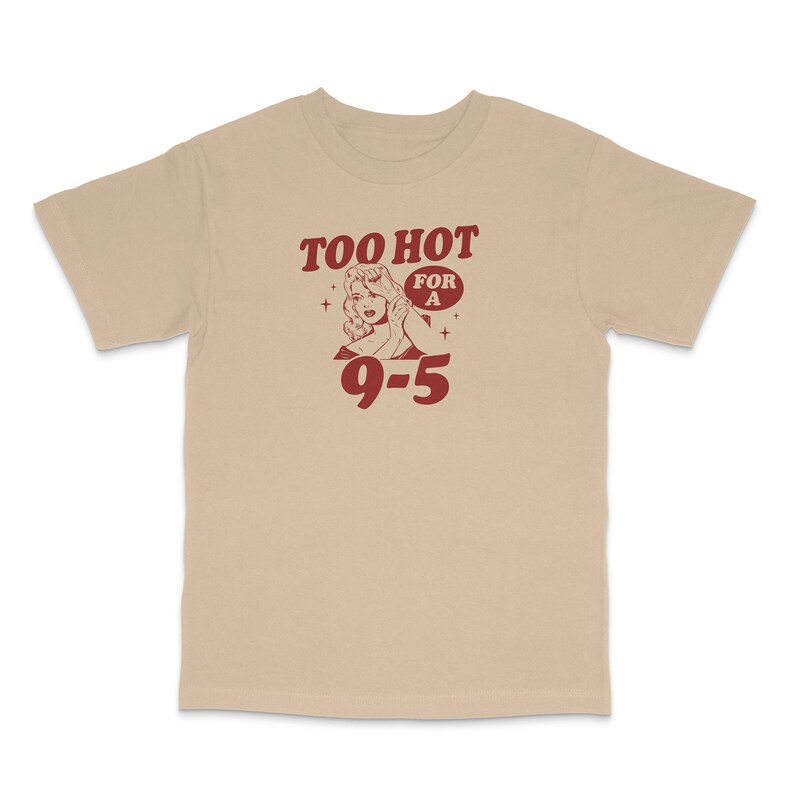 May include: Beige t-shirt with a red graphic of a woman with the text "Too Hot For A 9-5".