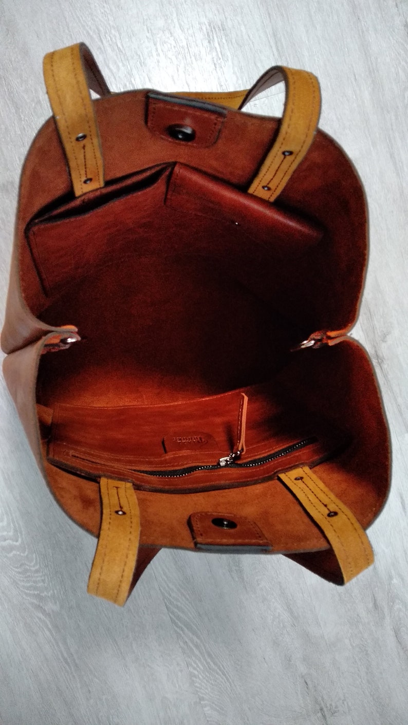 large leather bag with eagle print