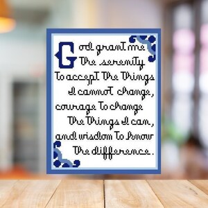 May include: A blue and white framed print with the text "God grant me the serenity to accept the things I cannot change, courage to change the things I can, and wisdom to know the difference."