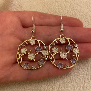 Silver dangle/ drop earrings with purple and white flowers and diamanté charms, flower earrings, circular flower earrings