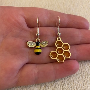 Silver dangle/ drop earrings with bee and honeycomb charms, bee earrings, honeycomb earrings, mismatched earrings, stocking filler