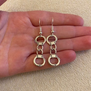 Silver dangle/ drop earrings with silver handcuff charms, silver handcuff earrings