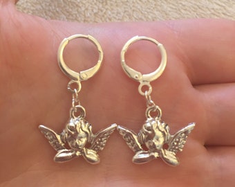 Silver huggie hoop earrings with silver cherub/ angel/ Cupid charm, silver cherub huggie hoop earrings, silver angel huggie hoop earrings