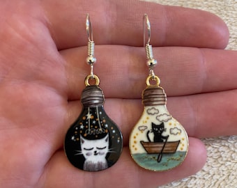 Silver dangle/ drop earrings with mismatch cat in a lightbulb charms, cat earrings, cat jewellery, mismatch earrings