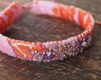 Unique bracelet made of silk, orange/pink, embroidered with filigree flowers and glass beads. ViVA La ViDa