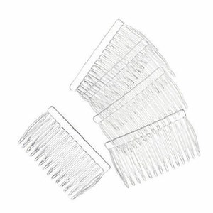 May include: Four clear plastic hair combs with fine teeth. The combs are stacked on top of each other.