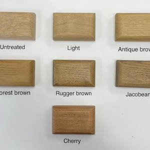 May include: Six wood samples showing different shades of brown, labeled "Untreated", "Light", "Antique brown", "Forest brown", "Rugger brown", "Jacobean", and "Cherry".