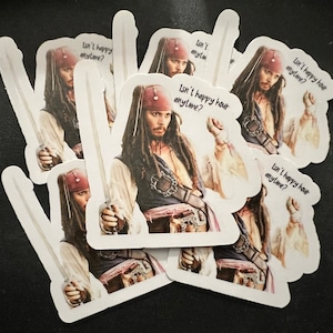 May include: A set of six white stickers featuring a photo of Johnny Depp as Captain Jack Sparrow from the Pirates of the Caribbean movies. The stickers have the text "Isn't happy hour anytime?" on them.