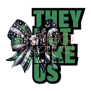 May include: Green and black cheer bow with rhinestones and the text "They don't like us" in green letters with black outlines.