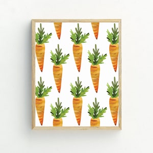 May include: A digital print featuring a repeating pattern of orange carrots with green leafy tops on a white background. The print is framed in a light wood frame.
