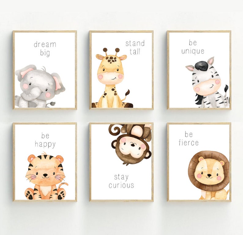 May include: Six framed prints with watercolour illustrations of animals and inspirational messages. The prints feature a giraffe, zebra, elephant, tiger, monkey, and lion. The messages include "dream big", "stand tall", "be unique", "be happy", "stay curious", and "be fierce".