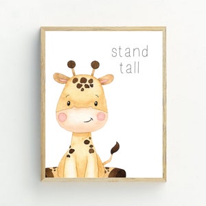 May include: A framed print featuring a watercolour illustration of a cute giraffe with the text "stand tall" in black.
