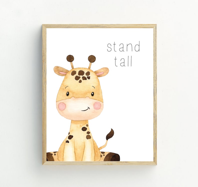 May include: A framed print featuring a watercolour illustration of a cute giraffe with the text "stand tall" in black.