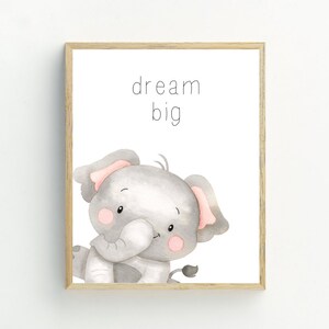 May include: A watercolour illustration of a cute grey elephant with pink ears, looking at the viewer. The text "dream big" is written above the elephant.