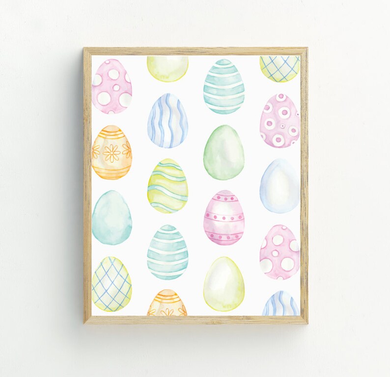 May include: A framed print featuring a pattern of colorful Easter eggs with various designs, including polka dots, stripes, and floral patterns.