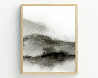 May include: A framed abstract watercolor painting with shades of gray and black. The painting depicts a landscape with a hazy, atmospheric effect.