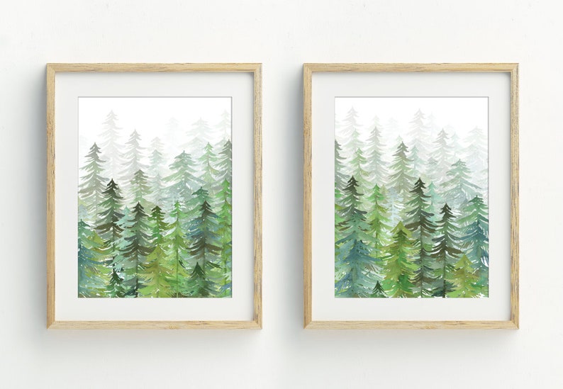 May include: Two framed watercolor paintings of a forest scene with green trees and a white background.