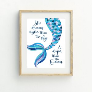 May include: A watercolor illustration of a mermaid tail with the text "She dreams higher than the sky & deeper than the ocean".