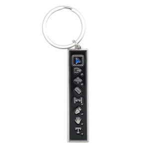 May include: A black metal keychain with a silver ring. The keychain features a vertical row of nine silver icons, including a cursor, a hand, a text tool, and a ruler.