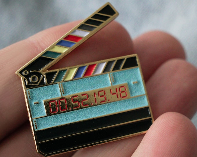 Glow in the dark timecode film slate movie clapper enamel pin! Great gift for filmmakers, movie lovers and sound department!