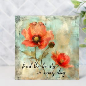 May include: Square art print featuring vibrant orange poppy flowers against a distressed teal and beige background. The artwork includes the text "find the beauty in every day" in elegant script.