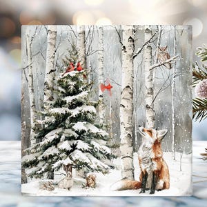 May include: A winter scene featuring a snow-covered forest with a fox, owl, and cardinals. A snow-covered evergreen tree is in the center. The artwork has a watercolor style with soft colors and a peaceful atmosphere.