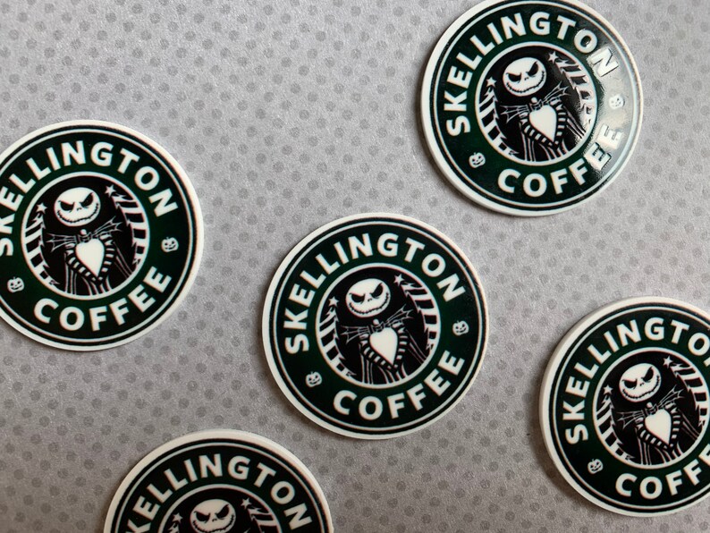 May include: Five round stickers with a black and white design of a skeleton character with a heart in its hand. The text "SKELINGTON COFFEE" is written in a circle around the character.
