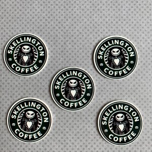 May include: Five black and white round stickers with the words "SKellington Coffee" in a circle around a black and white image of Jack Skellington from the Nightmare Before Christmas movie.