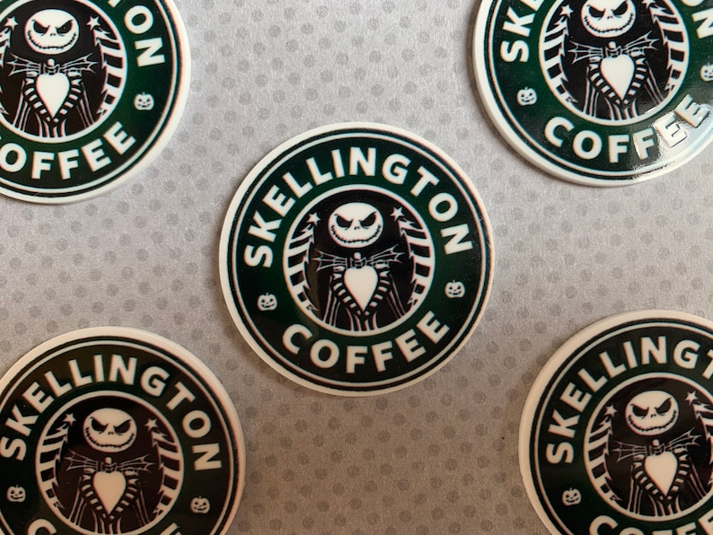 May include: Four round stickers with a black and white illustration of Jack Skellington from the Nightmare Before Christmas. The stickers have a green background and the text "Skellington Coffee" in white.