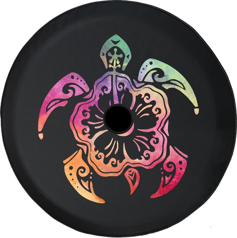 May include: Black spare tire cover featuring a colorful turtle design. The turtle is depicted in a floral style with a vibrant gradient of pink, orange, yellow, green, and purple. The cover has a central black hole.