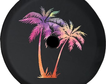 May include: Black spare tire cover featuring a watercolor design of two palm trees in shades of pink, purple, orange, and yellow. The palm trees are set against a black background, with a central hole.