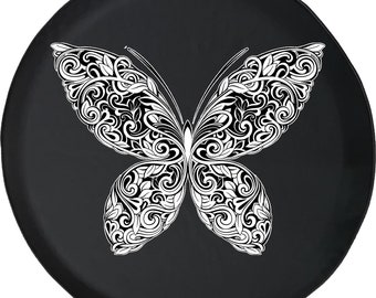 May include: Black spare tire cover featuring a detailed white butterfly design. The butterfly has intricate patterns of swirls and leaves, creating a striking contrast against the dark background. This cover adds a decorative touch to any vehicle.