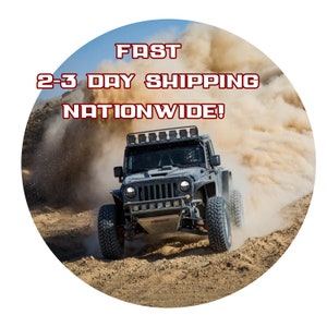 May include: A black off-road vehicle kicks up dust as it speeds across a desert landscape. The vehicle has a roll cage, off-road tires, and a light bar. Text in the image reads "FAST 2-3 DAY SHIPPING NATIONWIDE!"
