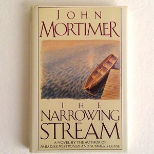 May include: A paperback book by John Mortimer, titled "The Narrowing Stream". The cover features a watercolour illustration of a boat moored to a wooden jetty. The title and author's name are in maroon, with the text "A Novel" below.