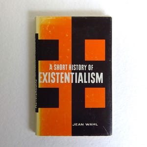 May include: A book titled "A Short History of Existentialism" by Jean Wahl. The cover is split vertically, with an orange and black geometric design. The title is in white, and the author's name is at the bottom.
