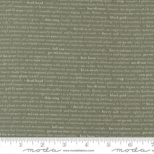 May include: Green fabric with a white text pattern. The text includes gardening terms such as 'crop', 'fertiliser', 'pollinate', 'heirloom', 'germination', 'dead-head', 'thinning', 'aerate', 'transplant', 'compost', 'hardiness', 'full sun', 'black gold', 'organic', 'micro-nutrients', 'heavy soil', 'horticulture', 'biennials', 'varieties', 'leaf growth', 'medium', 'variety', 'lin-at-or'. The fabric has a white 'moda' logo at the bottom.