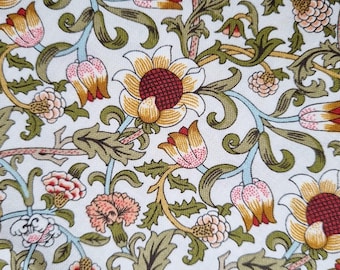 May include: A white fabric with a repeating pattern of stylized flowers and leaves in shades of green, yellow, red, and pink.