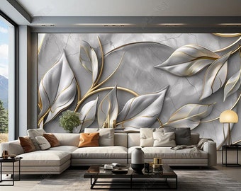 Puede incluir: Un diseño de interior de sala de estar con un sofá seccional blanco y una mesa de café. La pared detrás del sofá presenta un mural de pared 3D con un diseño de hojas grises y doradas.