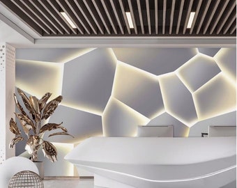 May include: A white modern reception desk with a curved front and a geometric patterned wall behind it. The wall is made of white panels with a light gray background and illuminated by LED lights.