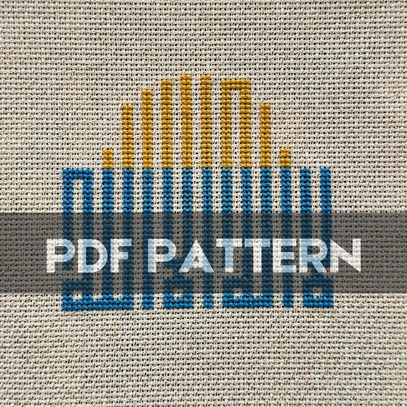May include: A cross stitch pattern for a sunset scene with a blue and yellow color scheme. The pattern is labeled "PDF PATTERN".