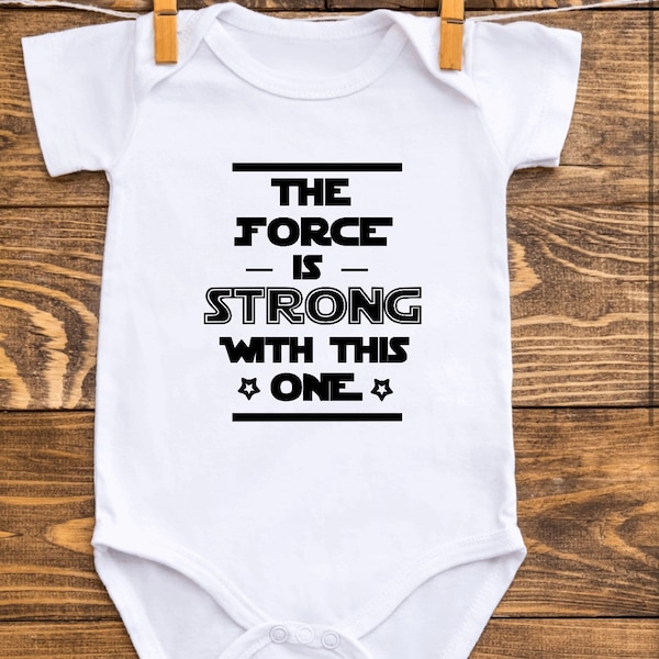 Star Wars baby vest. Great handmade gift for baby boys or girls. ‘The force is strong with this one’