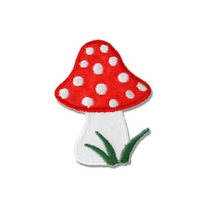 Può includere: Fungo rosso e bianco con punti bianchi ed erba verde alla base. Il fungo è ricamato su un tessuto bianco.