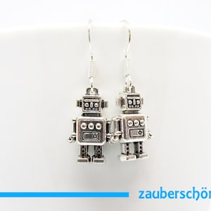 funny little robot earrings