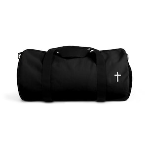 May include: Black duffel bag with a white cross embroidered on the side.