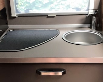 Funda protectora para la cubierta de cristal de la autocaravana Knaus VanSation Van: funda protectora contra arañazos en la placa de cristal, sirve también como protección contra vibraciones.