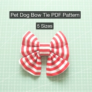 May include: Red and white striped bow tie for a pet dog. The bow tie is made of fabric and has a simple design.  Pet Dog Bow Tie PDF Pattern. 5 Sizes.