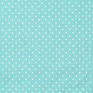 Op de afbeelding: Een turquoise stof met witte stippen. De stof is gemeten in inches.