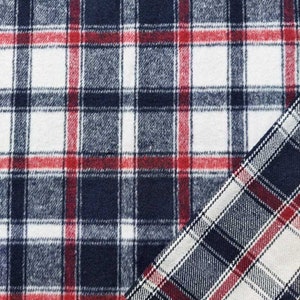 Könnte beinhalten: Nahaufnahme eines blauen, roten und weißen karierten Stoffes. Der Stoff hat eine weiche, flauschige Textur.
