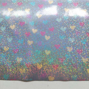 Regnrockstyg med folietryck av hjärtan och regnbågsglitter, grått