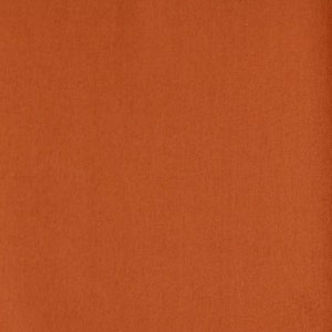 Może przedstawiać: Jednolity pomarańczowo-rdzawy materiał o gładkiej, jednolitej fakturze.